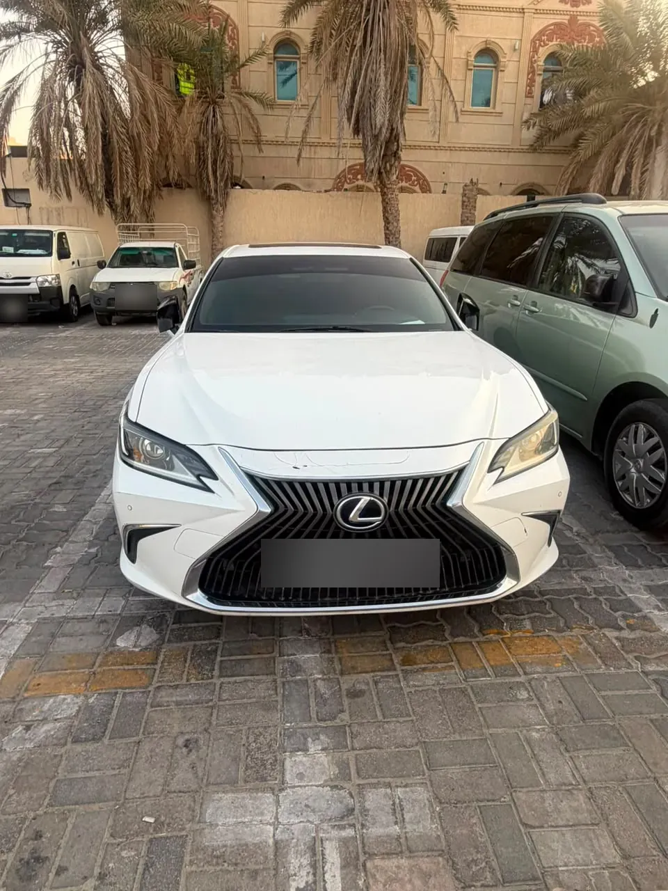 White Lexus sedan — CarLift Sharjah to Dubai car lift Dubai Sharjah