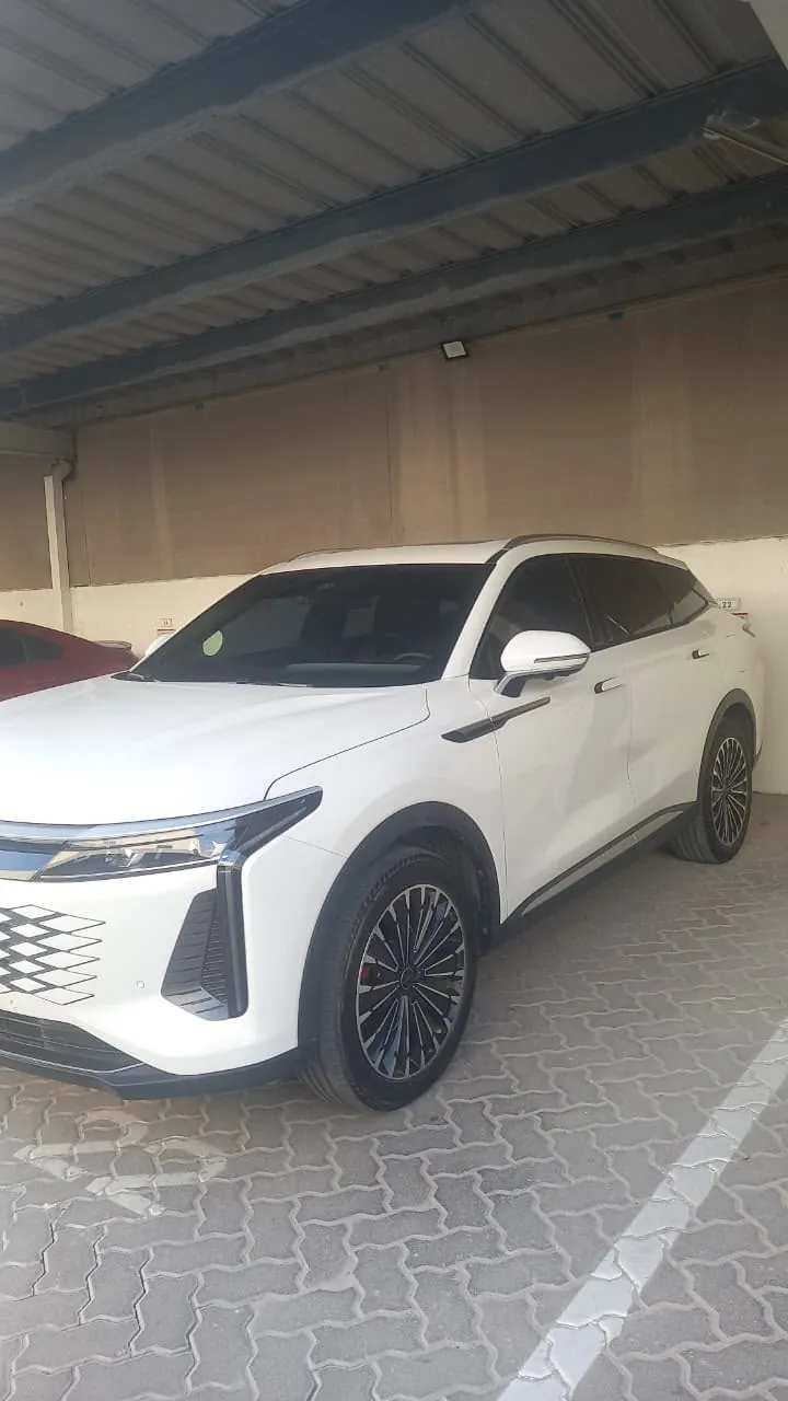 White SUV — CarLift Sharjah to Dubai car lift Dubai